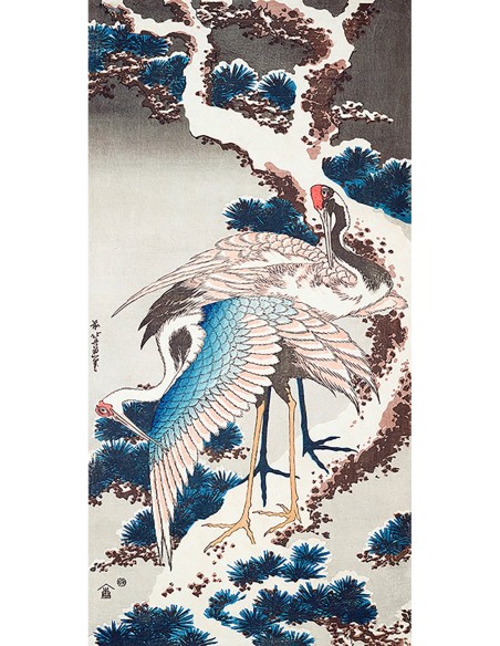 Grúas en un árbol nevado